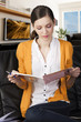 the girl reading a book with a pen in her right hand the girl reading a book with a pen in her right hand