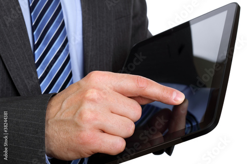 Foto: Finger pointing on digital tablet Finger pointing on digital tablet