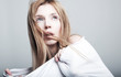 Foto: Frightened lovely woman blonde in white clothes Frightened lovely woman blonde in white clothes