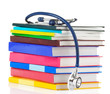 stethoscope and pile of books stethoscope and pile of books
