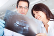 Dentist looking at an x-ray