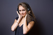 Gorgeous young brunette listening to music.