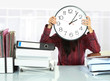 woman with big clock covering her face