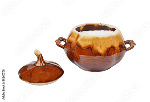 Photo: Ceramic pot with salt, isolated on white background Ceramic pot with salt, isolated on white background