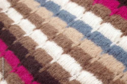 Photo: Closeup of multicolored woolen texture Closeup of multicolored woolen texture