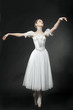 Beautiful dancer posing on studio background