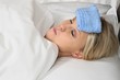 Sick Blond Woman in Bed