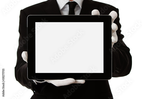 Photo: Elegant man holding blank digital tablet with clipping path Elegant man holding blank digital tablet with clipping path