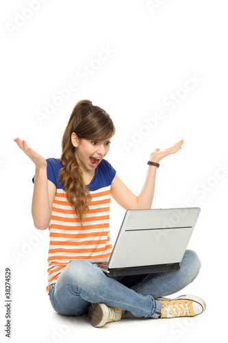 Photo: Surprised woman using laptop Surprised woman using laptop
