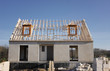 house under construction with the roof structure of wood