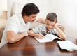 Father helping son do homework