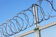 Fence with a barbed wire.