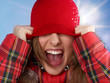Foto: Woman pulled a cap over her head and shouts out loud Woman pulled a cap over her head and shouts out loud