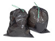 two tied garbage bags on white