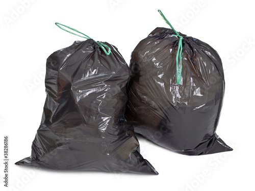Photo: two tied garbage bags on white two tied garbage bags on white