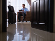 Businessman using digital tablet pc in hotel room
