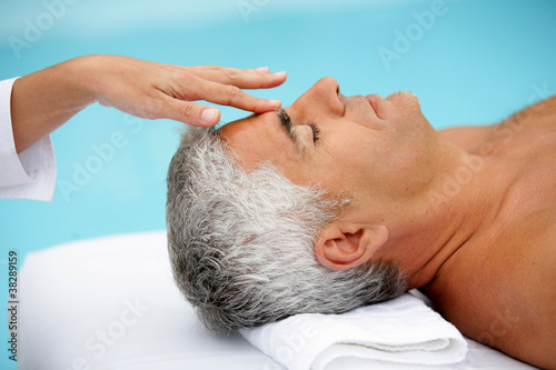 Photo: Mature man having facial massage Mature man having facial massage