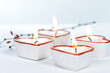 Four heart-shaped candles