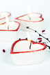 Four heart-shaped candles