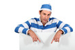 Man in a mock prisoner outfit with a board