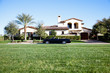 Luxurious car parked outside house in front yard