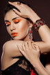 elegant fashionable woman with red jewelry elegant fashionable woman with red jewelry