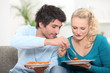 Photo: young couple having dinner at home young couple having dinner at home