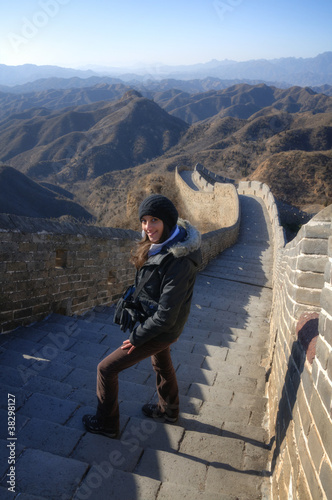 Photo: Beautiful girl standing on the Great Wall of China - Simatai Beautiful girl standing on the Great Wall of China - Simatai