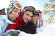 Ski couples lying in the snow