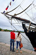 Man and woman at the old ship.