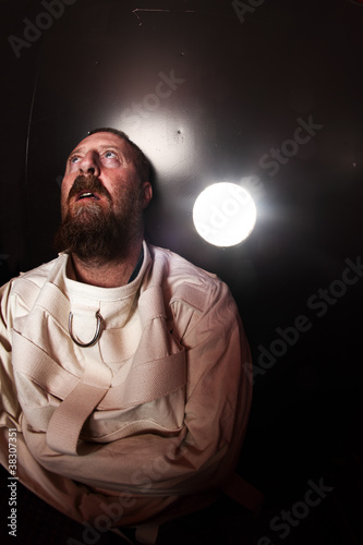 Photo: Crazy person in a straitjacket Crazy person in a straitjacket