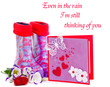 Rubber boots and greeting card