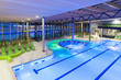 Photo: view from the top of a new swimming pool with green divans view from the top of a new swimming pool with green divans