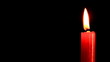 Bringing candle on background of the color lights