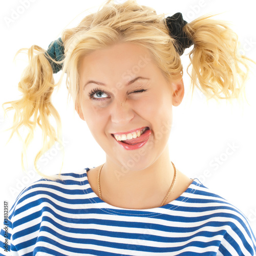 Photo: Woman with a funny look on her face smiles Woman with a funny look on her face smiles