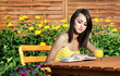 Girl reading a book in the garden