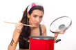 Photo: Beautiful young woman cooking Beautiful young woman cooking