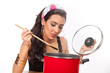 Photo: Beautiful young woman cooking Beautiful young woman cooking