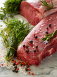 raw porterhouse and tenderloin with mixed herbs juniper berry