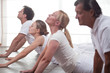 Group of people practising yoga