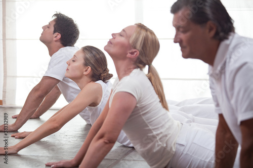Photo: Group of people practising yoga Group of people practising yoga