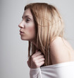 Worried sleepy half-dressed  pale  girl in white clothes