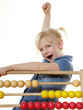 Foto: Cute child celebrates her traning success at an abacus Cute child celebrates her traning success at an abacus