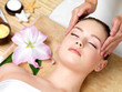 Photo: woman having spa massage of the head woman having spa massage of the head