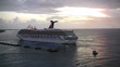 Cruise ship departing at sunset