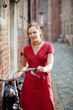 Pretty young woman with bicycle