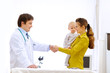 Mother thanked pediatrician doctor for examination of baby