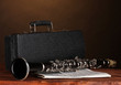 old clarinet, case and notebook with notes old clarinet, case and notebook with notes