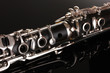 close up detail of clarinet on black background close up detail of clarinet on black background