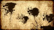 Ink stains on old grungy worn paper background Ink stains on old grungy worn paper background